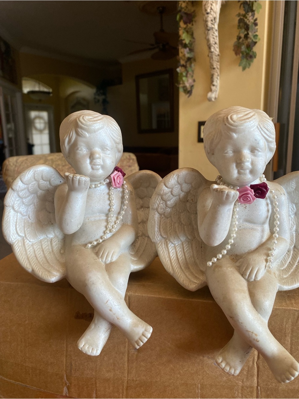 White Ceramic Cherub Figurine Sitting and Blowing A Kiss